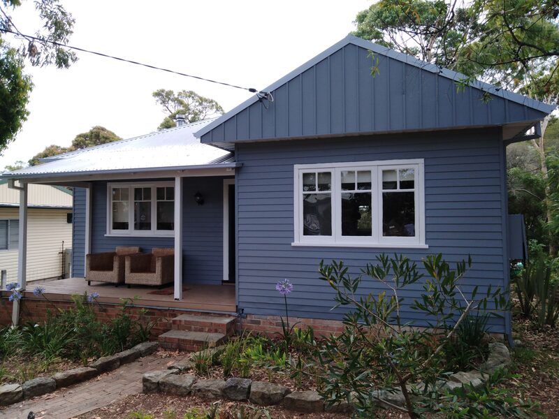 Front facade of house, newly painted in the colour blue, located at Lake Munmorah.